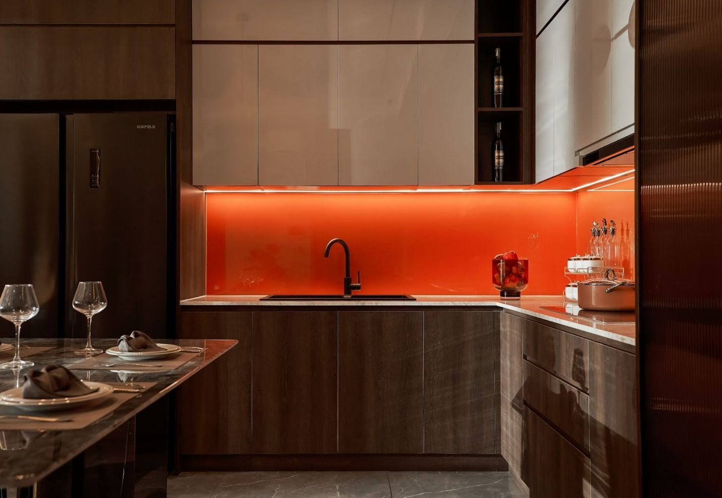 A kitchen with orange lightingAI-generated content may be incorrect.